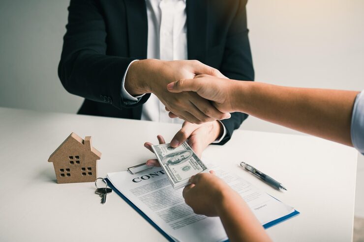 cropped hand customer giving money real estate agent