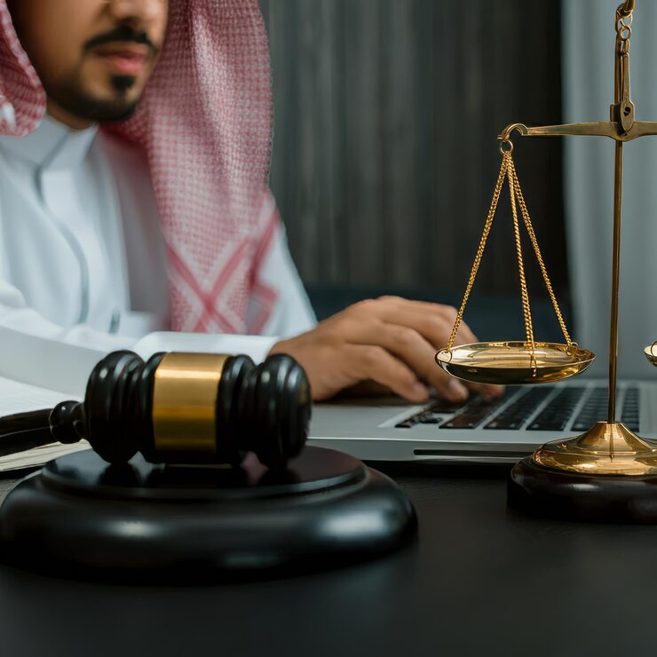 man using laptop with hammer hammer